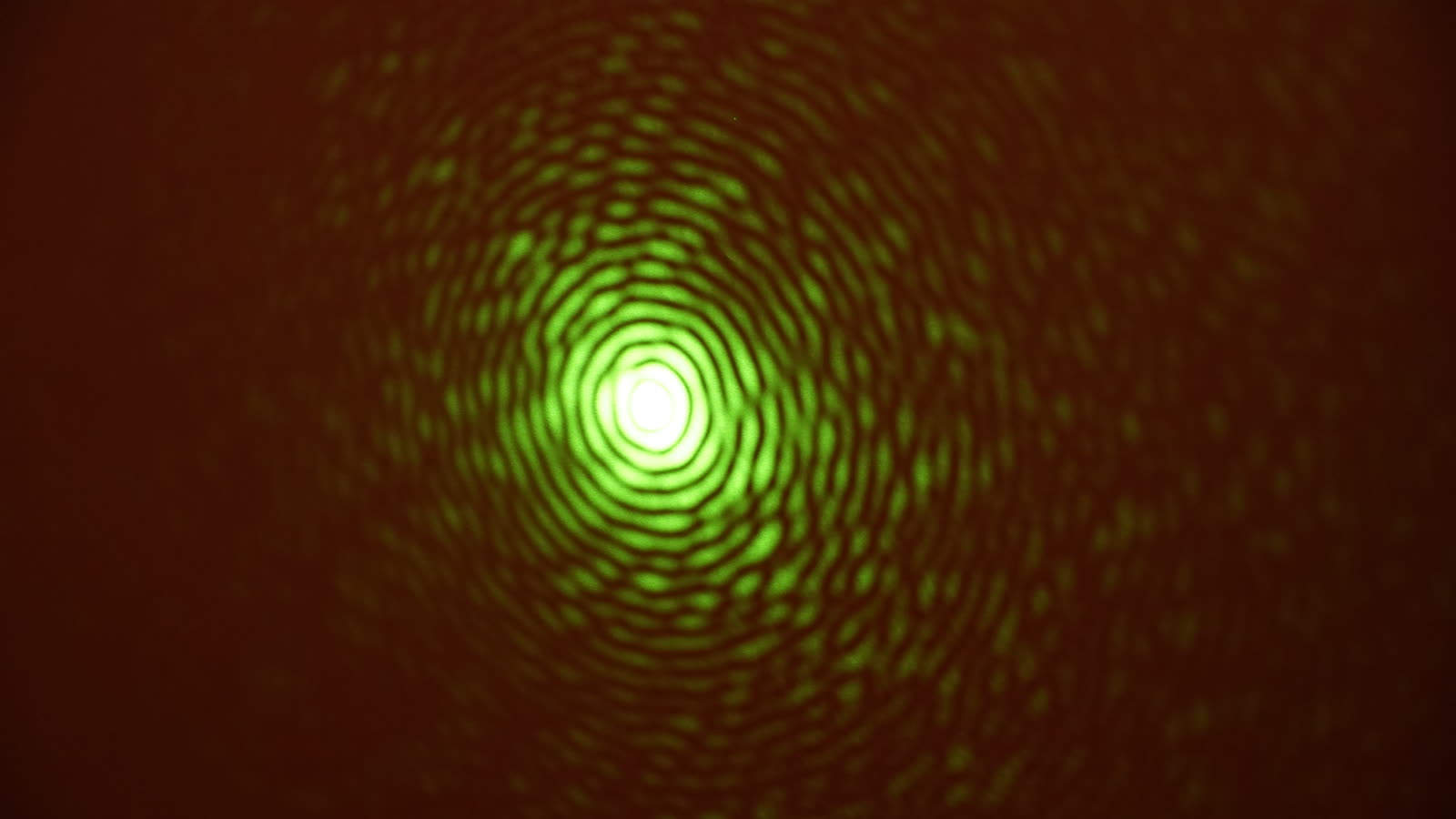 Green-laser diffraction through a circular aperture (long exposure)